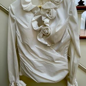 Beautiful chiffon top with ruched detail with satin roses and ruffle sleeves.
